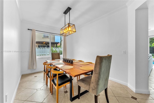 dining room featuring light tile patterned floors and ornamental molding