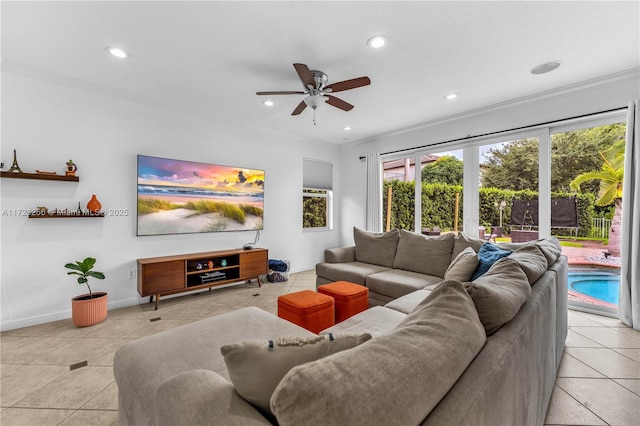 living room featuring ceiling fan, light tile patterned flooring, and crown molding