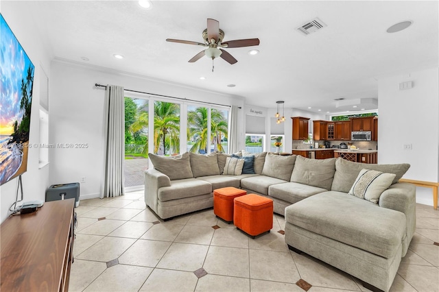 tiled living room featuring ceiling fan