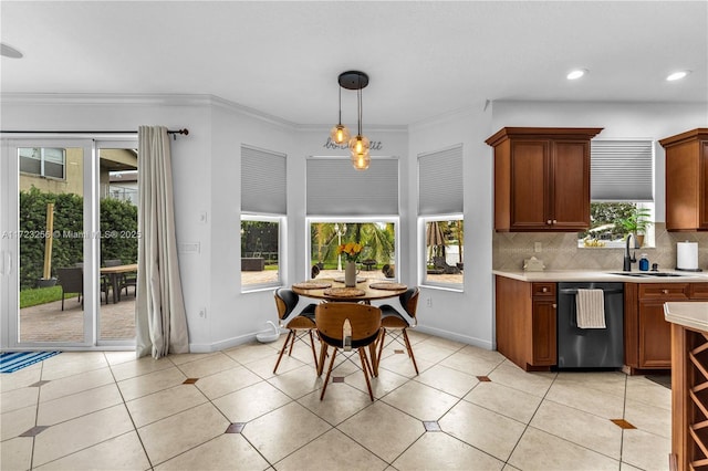 kitchen with decorative backsplash, ornamental molding, sink, decorative light fixtures, and dishwasher