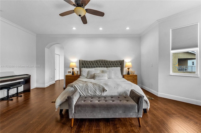 bedroom featuring ceiling fan, dark hardwood / wood-style floors, and ornamental molding