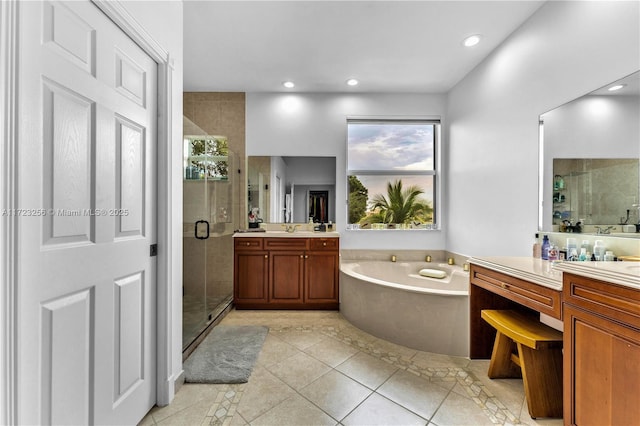 bathroom featuring tile patterned floors, vanity, and plus walk in shower