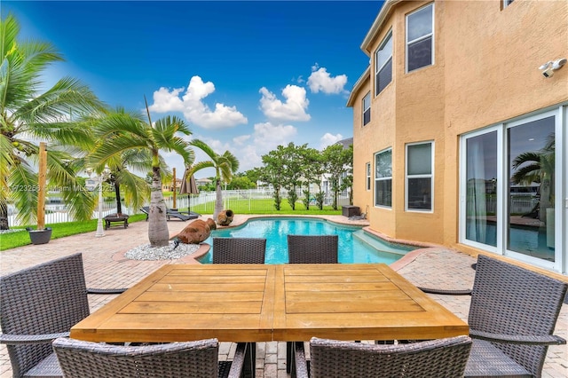 view of swimming pool with a patio