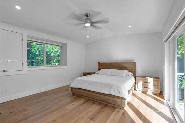 bedroom featuring access to exterior, ceiling fan, light hardwood / wood-style floors, and vaulted ceiling