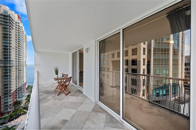 balcony featuring a water view