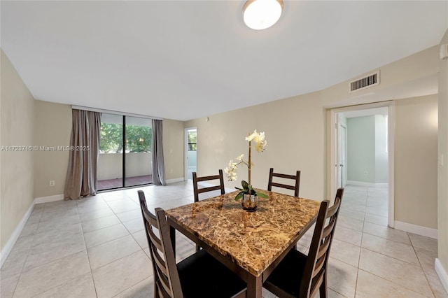 dining area featuring light tile patterned floors