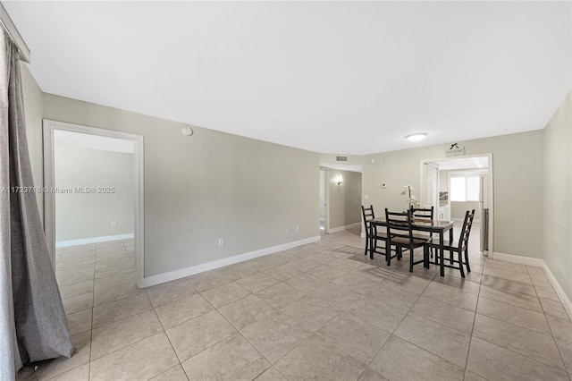 dining room featuring light tile patterned flooring