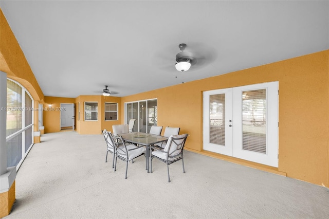 sunroom with french doors and ceiling fan