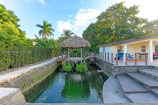 view of swimming pool featuring a patio and a gazebo