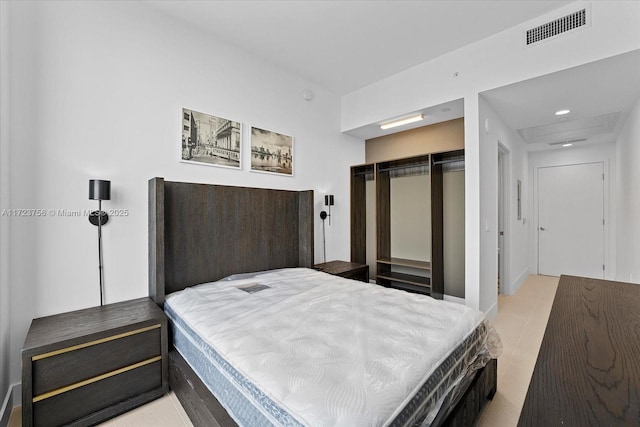 tiled bedroom featuring a closet