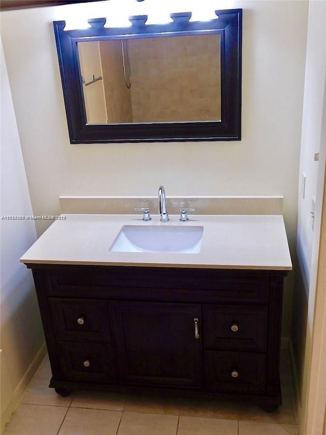 bathroom featuring tile patterned floors and vanity