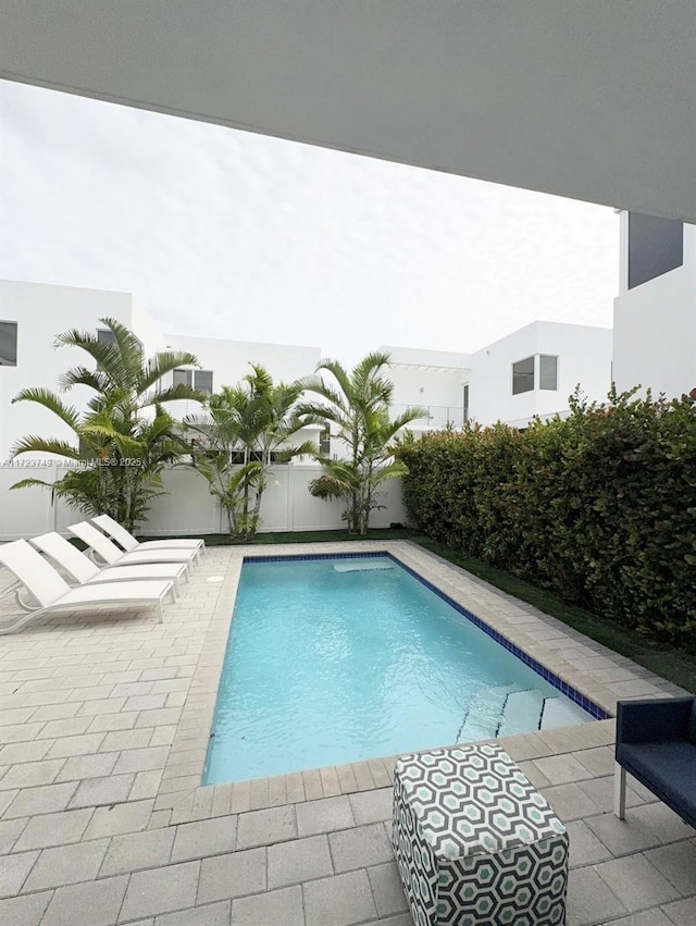 view of pool with a fenced in pool, a patio area, and a fenced backyard