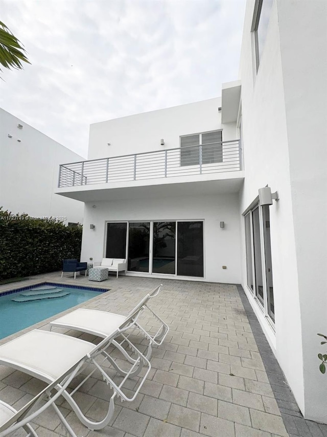 view of pool with a fenced in pool and a patio area