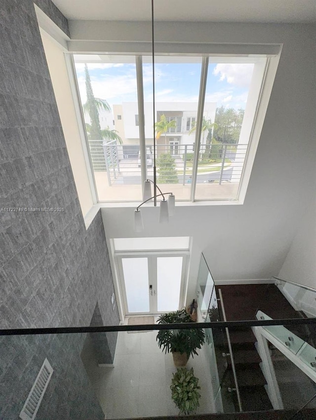 staircase with visible vents and french doors