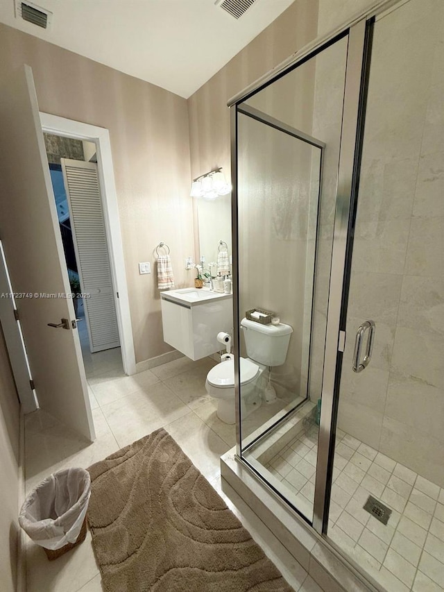 bathroom with toilet, a stall shower, visible vents, and tile patterned floors