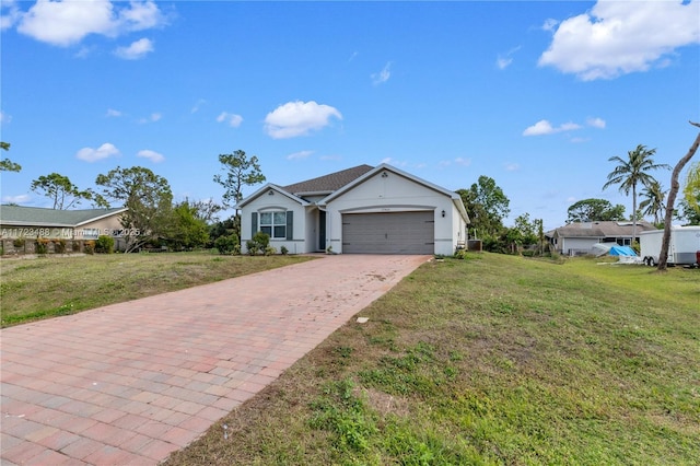 ranch-style house with a garage and a front yard