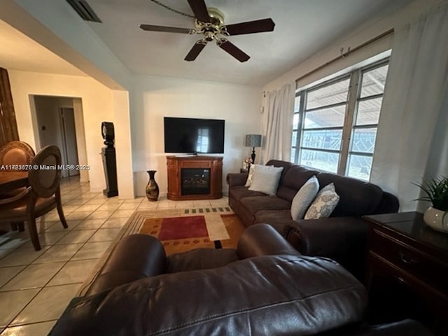 living room with light tile patterned floors and ceiling fan