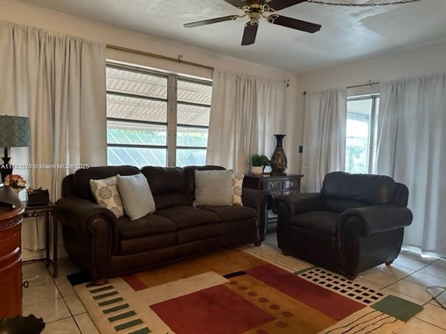 tiled living room with ceiling fan