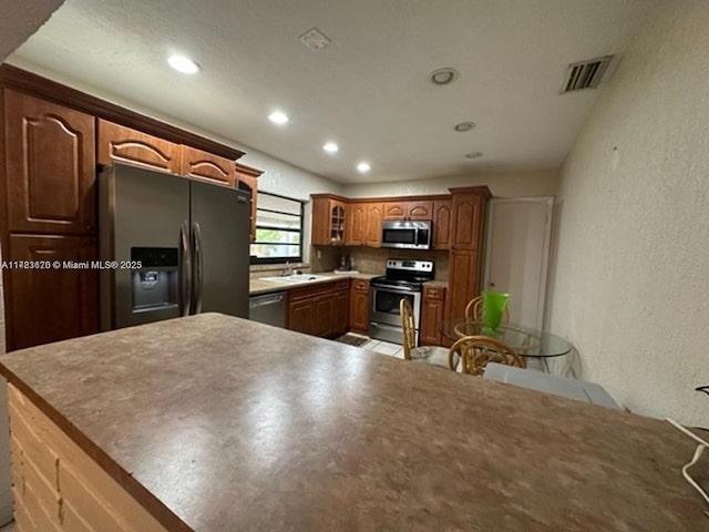 kitchen featuring sink and appliances with stainless steel finishes