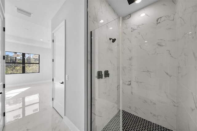 bathroom featuring a tile shower