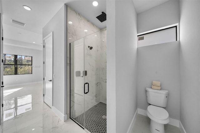 bathroom with an enclosed shower and toilet