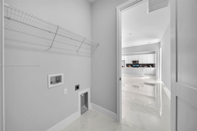 laundry room featuring electric dryer hookup and washer hookup