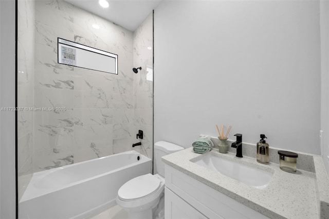 full bathroom with toilet, vanity, and tiled shower / bath