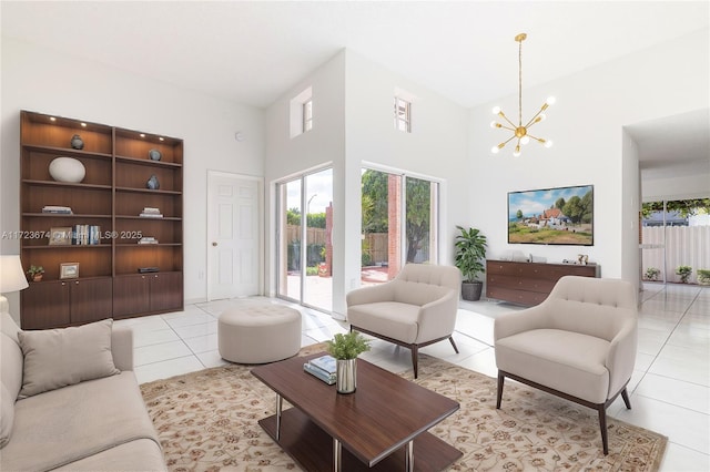 living room featuring light tile patterned flooring, a chandelier, and a high ceiling