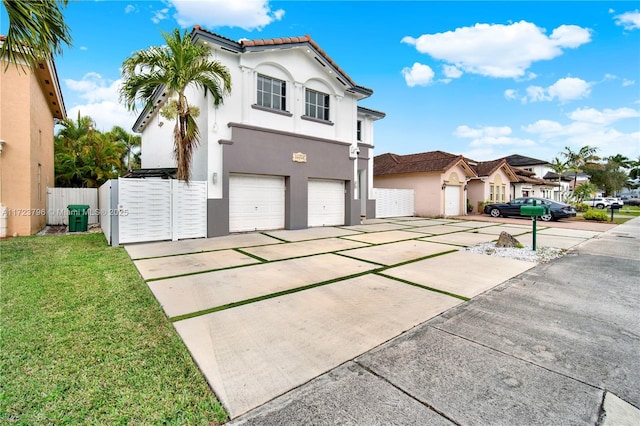 view of front facade with a front yard and a garage