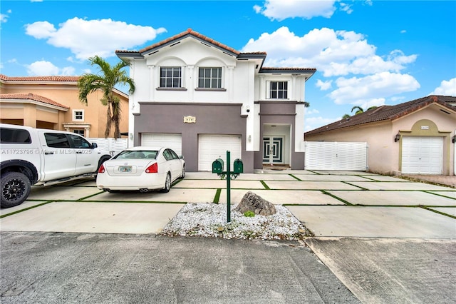 mediterranean / spanish-style house with a garage