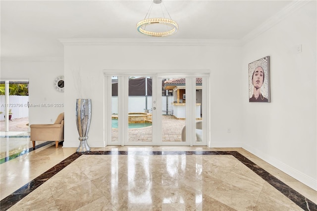 entryway featuring french doors and crown molding