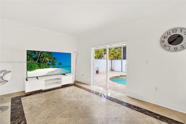 unfurnished living room with crown molding