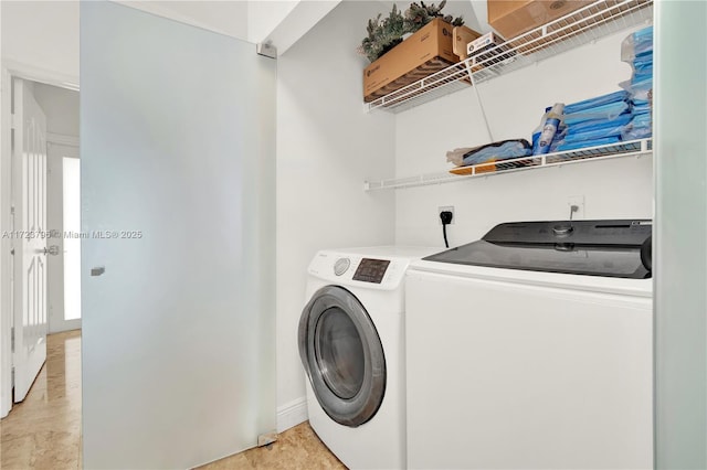 laundry area with washing machine and dryer