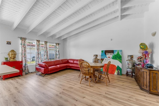 dining room with vaulted ceiling with beams, wooden ceiling, and light wood-type flooring