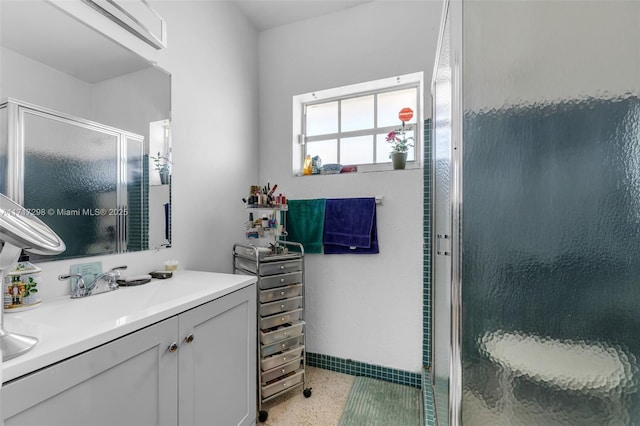 bathroom featuring vanity and walk in shower