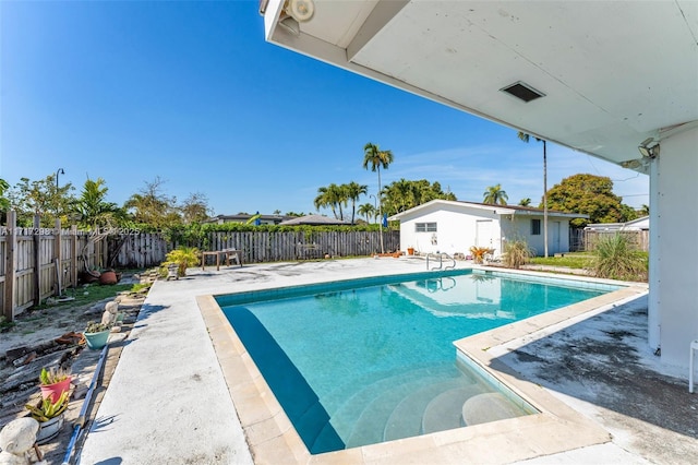 view of swimming pool with a patio area