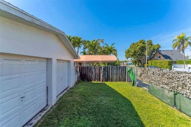 view of yard with a garage