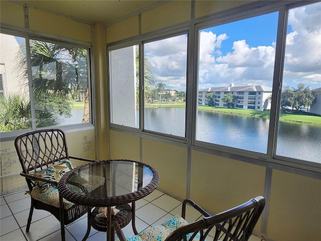 sunroom / solarium with a water view