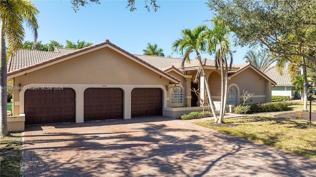 view of front of home with a garage