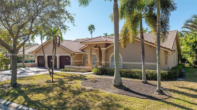 view of front facade featuring a garage and a front lawn