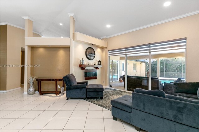 living room with ornamental molding and light tile patterned floors