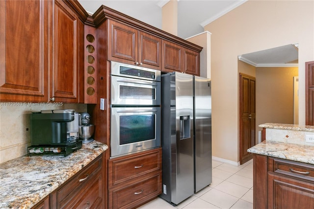 kitchen featuring light stone countertops, light tile patterned floors, stainless steel appliances, and crown molding