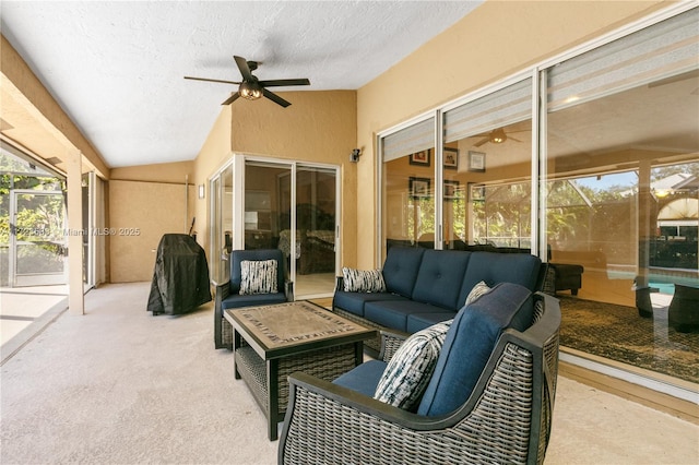 sunroom featuring ceiling fan and lofted ceiling