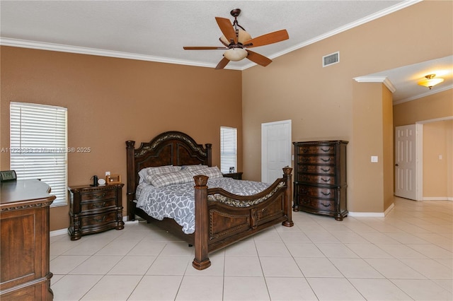 bedroom with ceiling fan, crown molding, light tile patterned flooring, and a textured ceiling