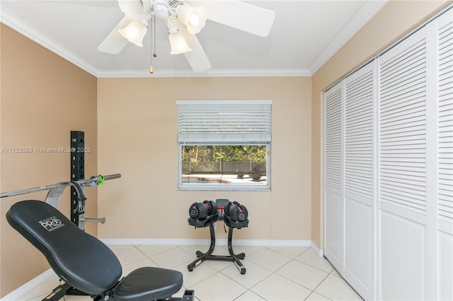 workout room featuring light tile patterned floors, ceiling fan, and crown molding