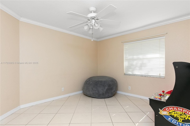 sitting room with ceiling fan, light tile patterned floors, and ornamental molding