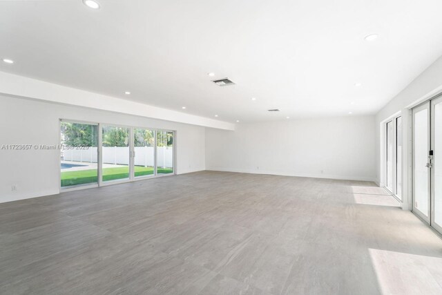 unfurnished room with light wood-type flooring