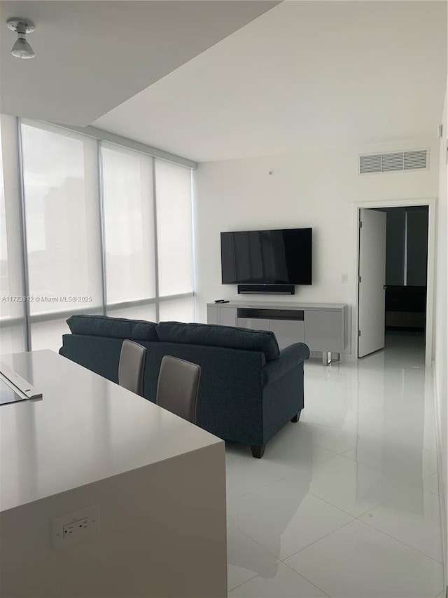 living room featuring light tile patterned flooring