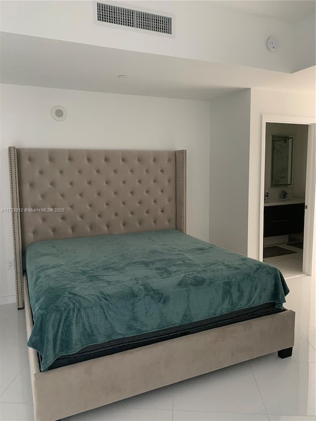 tiled bedroom with ensuite bathroom