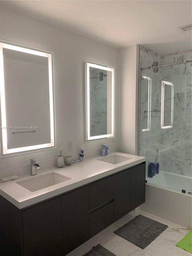 bathroom with vanity and tiled shower / bath